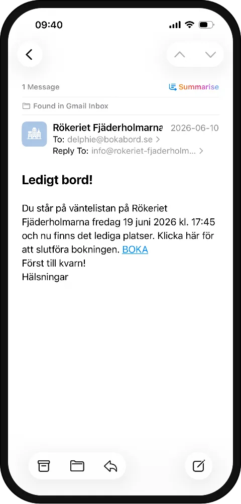 Mobiltelefon som visar ett mejl om att ett bord blivit ledigt från väntelistan